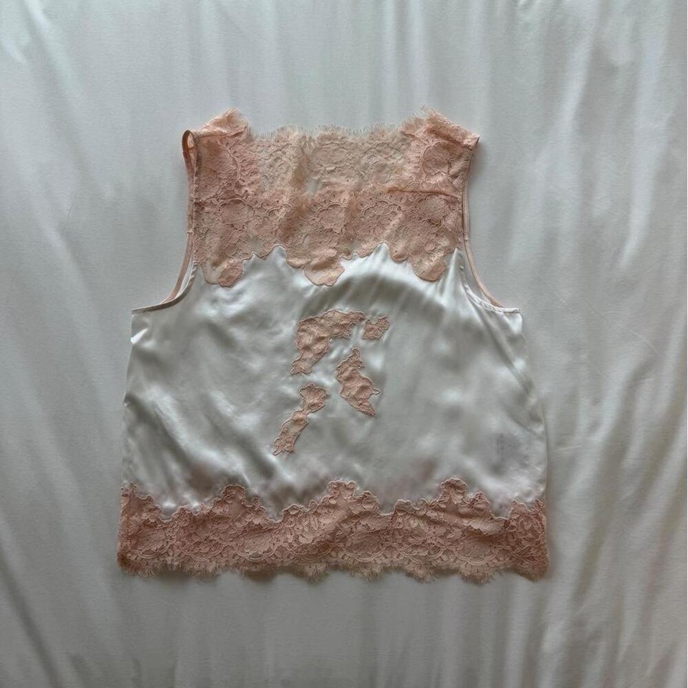 White silk tank top with pink lace trim and floral embroidery